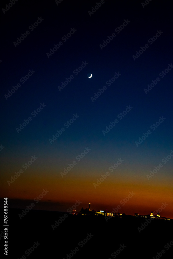 Sunset, Moon and Evening Sky over Maspalomas on Gran Canary Island Spain.