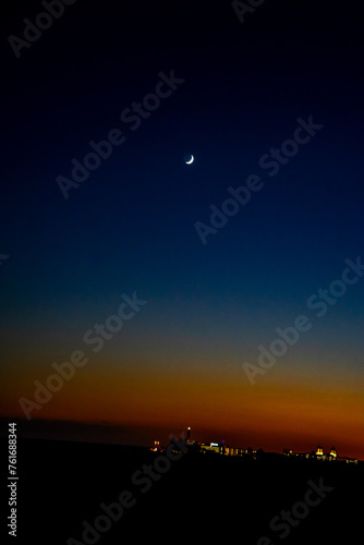 Sunset  Moon and Evening Sky over Maspalomas on Gran Canary Island Spain.