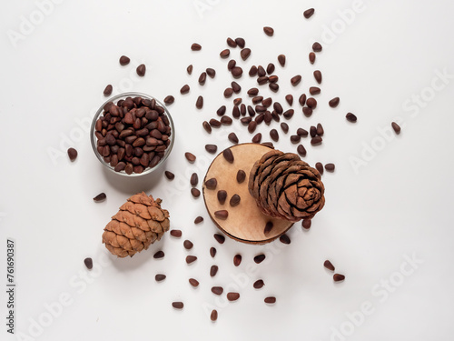 Cedar cones and nuts in shells on a white background.