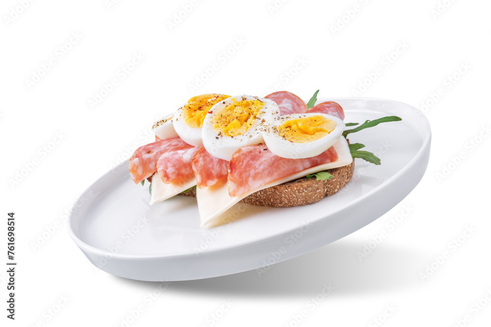 Salami sausages arugula cheese egg rye bread sandwich on a white isolated background