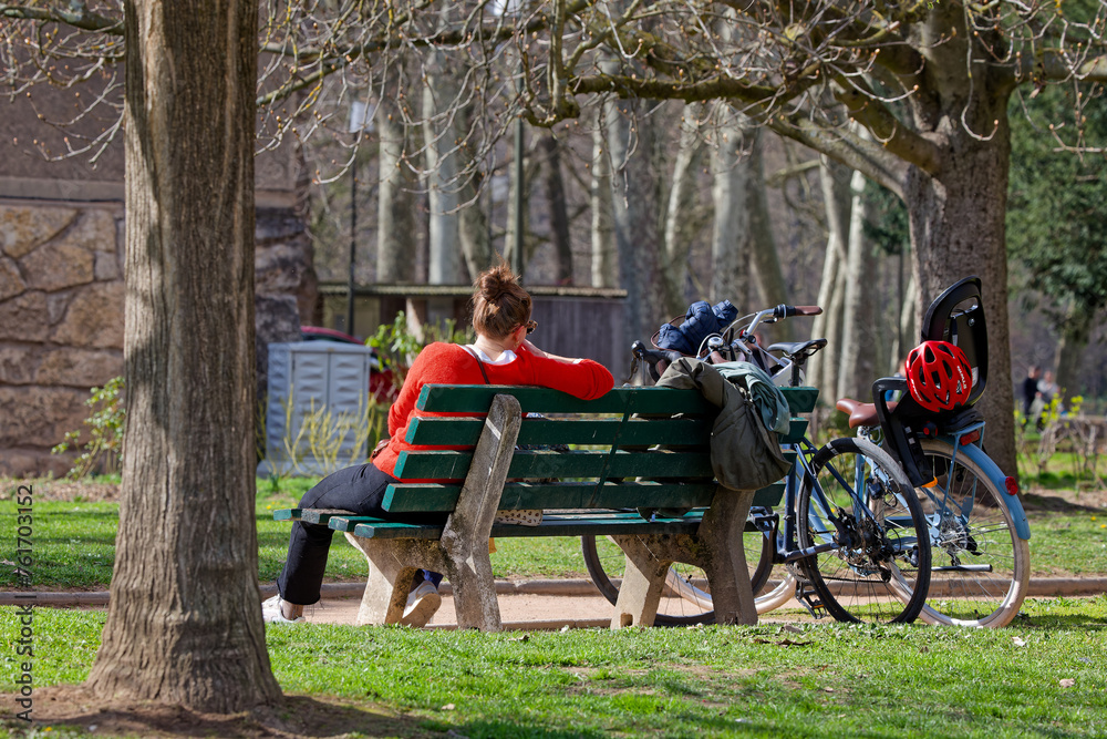 LYON, FRANCE, March 16, 2024 : Bikers rest in the city park LYON, FRANCE, March 16, 2024 : Bikers rest in the city park