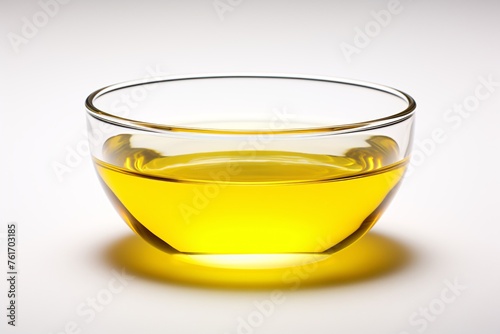 a glass bowl with yellow liquid in it