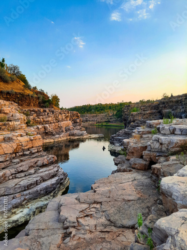 A beautiful lake surrounded by rocky mountain at Chidiya Bhadak, Indore, Madhya Pradesh, India.