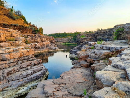 A beautiful lake surrounded by rocky mountain at Chidiya Bhadak, Indore, Madhya Pradesh, India.