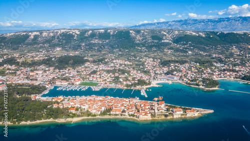 Behold the enchanting beauty of the historic town of Rab, nestled on the picturesque island of Rab in Croatia сaptured from a drone