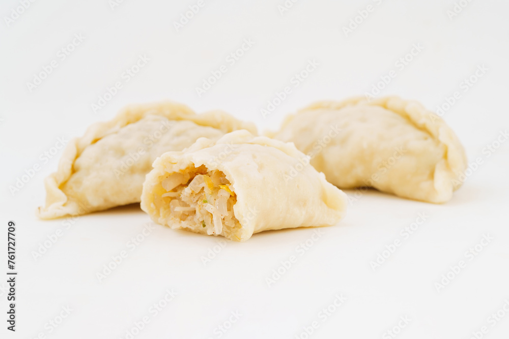 Northeastern large dumplings with vegetarian stuffing on white background Northeastern large dumplings with vegetarian stuffing on white background