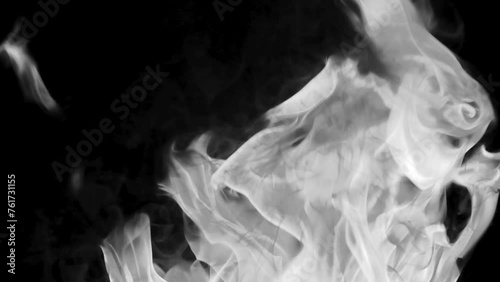 Slow-motion video of fire and flames.A fire pit, burning gas or gasoline burns with fire and flames.Flames and burning sparks close-up,fire patterns.A hellish glow of fire in the dark with copy space