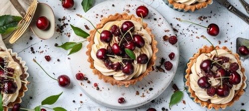 Delicious cherry mini tart on white cutting board with vintage teaspoons, top view food photography