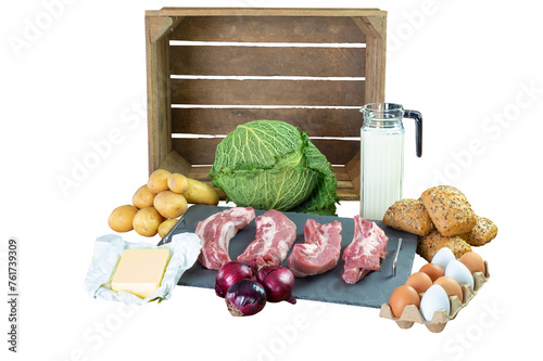 Transparent background. Food Vegetables, potatoes, meat, bread, eggs and milk isolated in front of a wooden fruit crate.