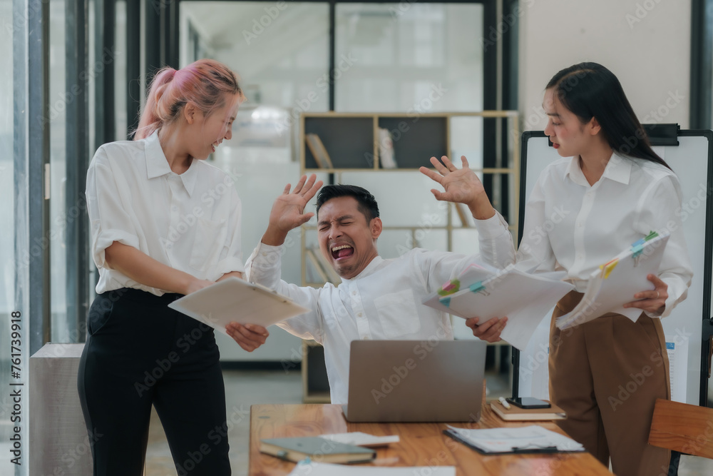 Overwhelmed businessman with too much work while two colleagues are scolding. High-pressure job and deadline stress concept.