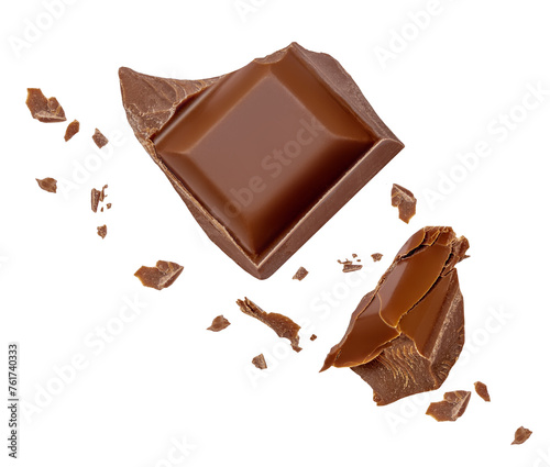 Flying chocolate pieces isolated on white background. Broken choco chunks with crumbs Top view. Flat lay.