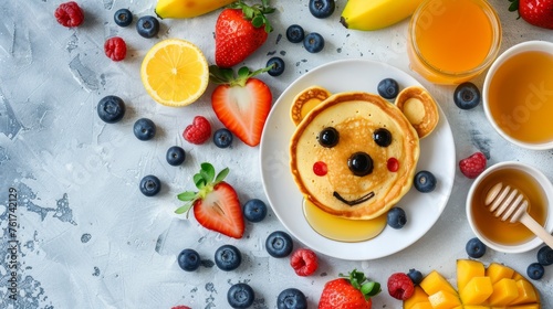 Adorable dog face pancake with berries and honey on white plate, kids breakfast on bright background