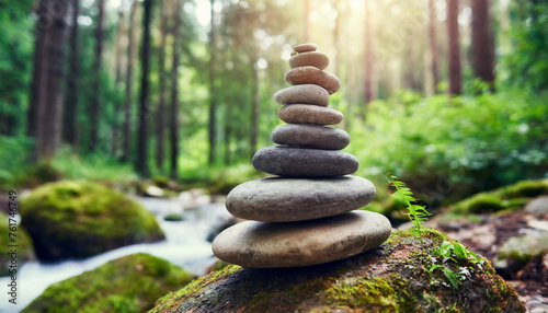 Pyramid of several flat river Zen stones. Balance and inner equilibrium. Meditative lifestyle. Natural backdrop.