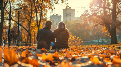 Autumn romance: couple enjoying sunset in park © edojob
