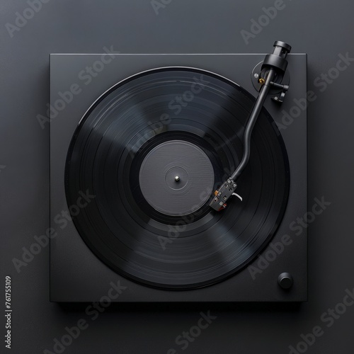 A record player with a vinyl record lying sideways on it, not playing.