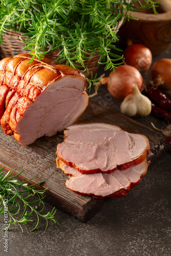 Canvas Print Smoked pork ham on a kitchen table.