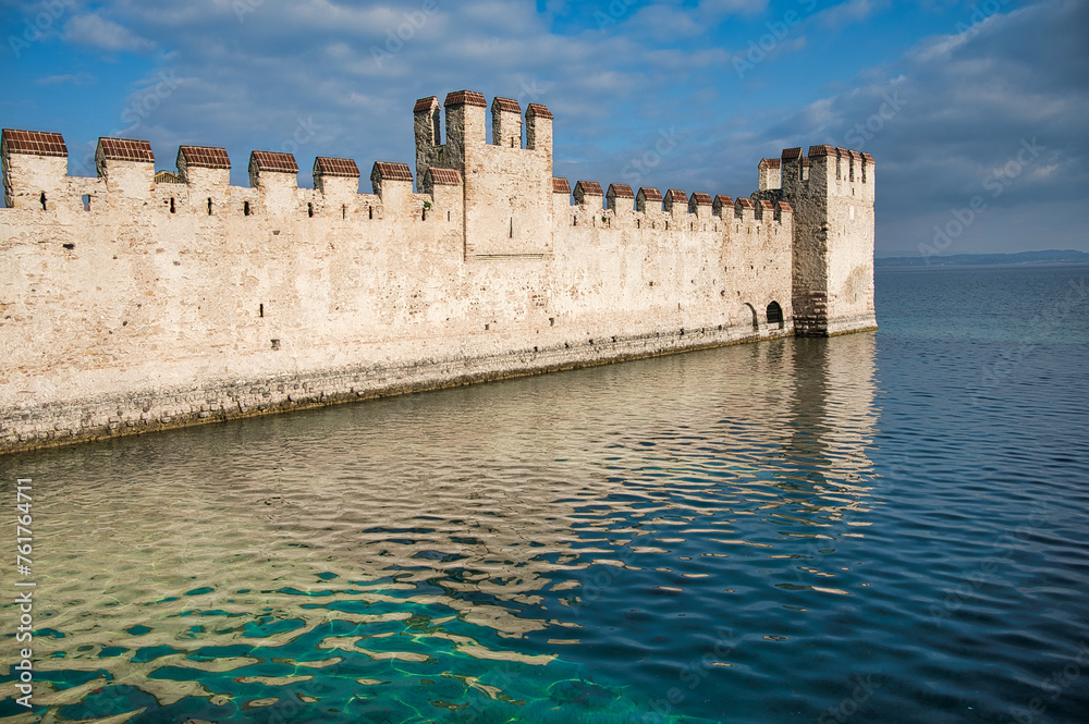 Guardian of History: A Magnificent Glimpse of the Ancient Stone Walls and Towering Turrets of Sirmione Castle, Perched on the Shores of Lake Garda, Preserving Centuries of Rich Heritage and Intriguing