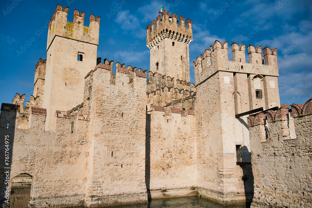 Guardian of History: A Magnificent Glimpse of the Ancient Stone Walls and Towering Turrets of Sirmione Castle, Perched on the Shores of Lake Garda, Preserving Centuries of Rich Heritage and Intriguing