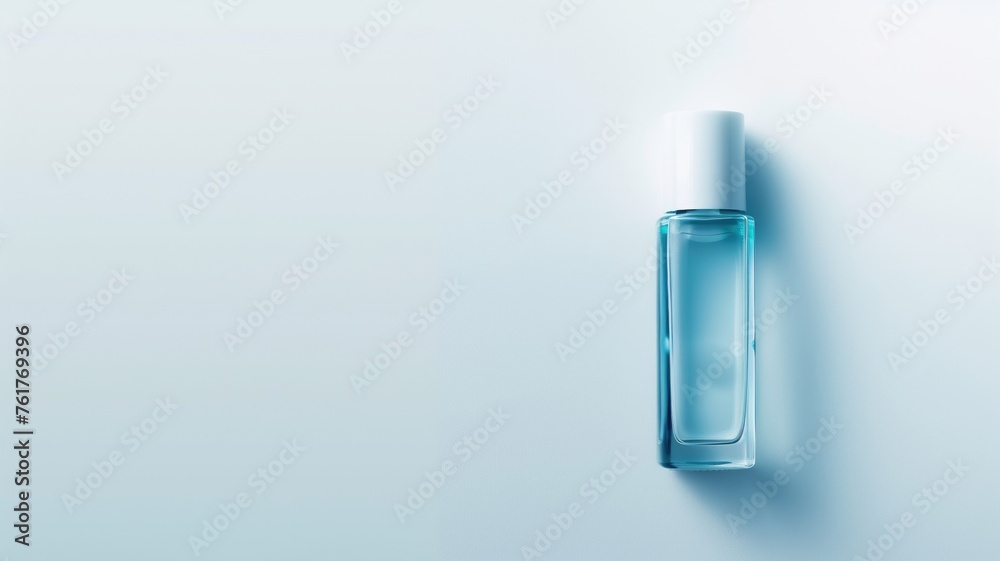 Elegant blue bottle on a serene blue backdrop, simplicity in design - obrazy, fototapety, plakaty 