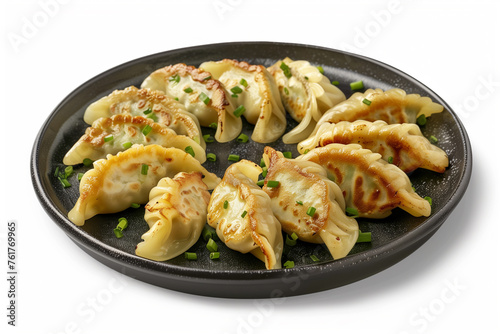 Taiwanese and Japanese Pan-fried gyoza dumpling jiaozi food in a plate isolated on white background
