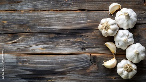 Pile of Garlic on Wooden Table photo