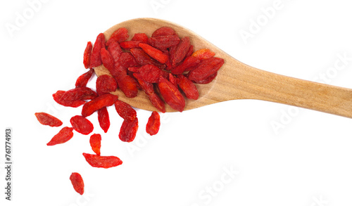 Pile dried Chinese wolfberries in wooden spoon, pattern goji berries isolated on white background, top view photo