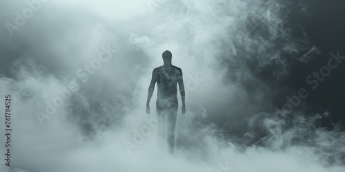 dark silhouette of a man coming out of a misty fog scary