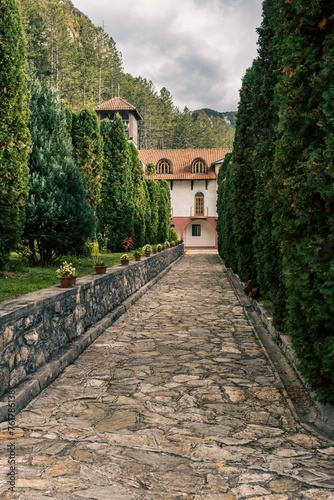 Stone walkway in a park of Orthodox Monastery photo