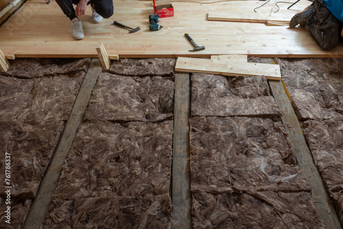 Creating a new wooden plank floor. House renovation