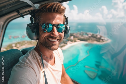 Beaming man with headphones pilots a helicopter, showcasing vibrant coastal views