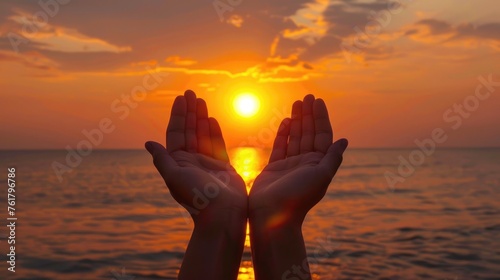 Praying Hands Holding the Sun at Dawn: A Religious Blessing and Protection with Joy in Nature's Glory
