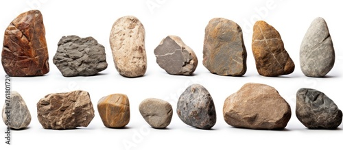 A diverse collection of rocks in various sizes and shapes displayed on a clean white background, showcasing natural materials and artifacts