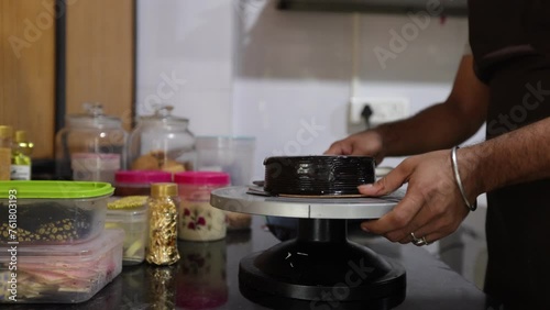Process of making chocolate cake. Unrecognizable man chef, cook prepares cake in his kitchen. 