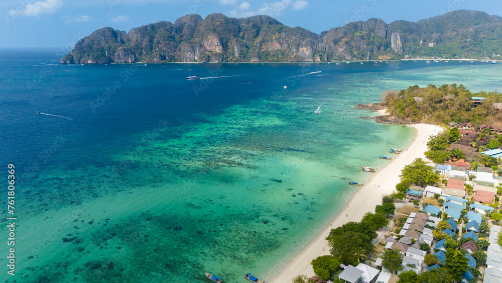 Long beach at Koh Phi Phi island, Krabi, Thailand. Tropical paradise white sand beach with turquoise waters of Andaman sea, aerial view towards Tonsai bay.