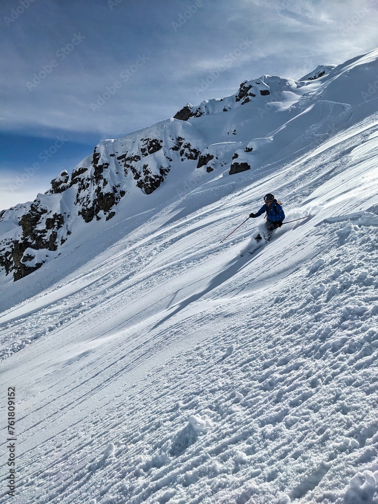 Beautiful deep snow descent from the Buelenhorn mountain peak in Davos Monstein. First line. Ski tour in the Swiss mountains. Ski mountaineering. Freeride Ski. . High quality photo