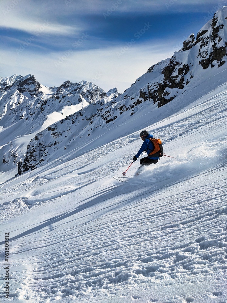 Beautiful deep snow descent from the Buelenhorn mountain peak in Davos Monstein. First line. Ski tour in the Swiss mountains. Ski mountaineering. Freeride Ski. . High quality photo
