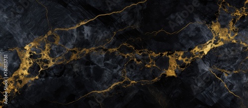 A stunning close up of black marble with intricate gold veins resembling a sky full of clouds, a natural landscape or a dark mysterious water scene