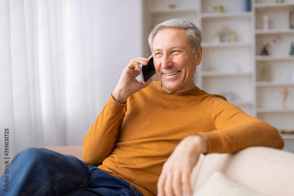 Happy older man talking on the phone