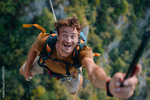 Smiling man looking at his smartphone while doing a bungee jump. Generative AI photo