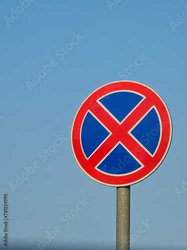 no parking sign on blue sky