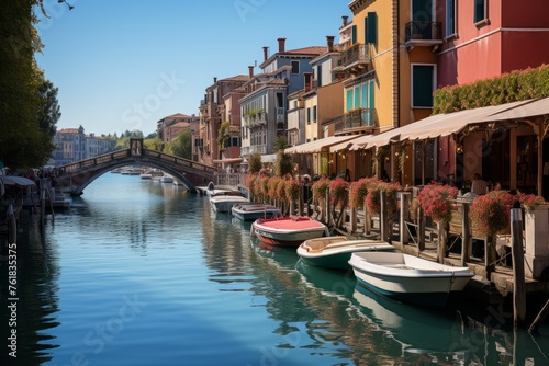 a row of boats are docked next to a canal in venice © Yuchen Dong