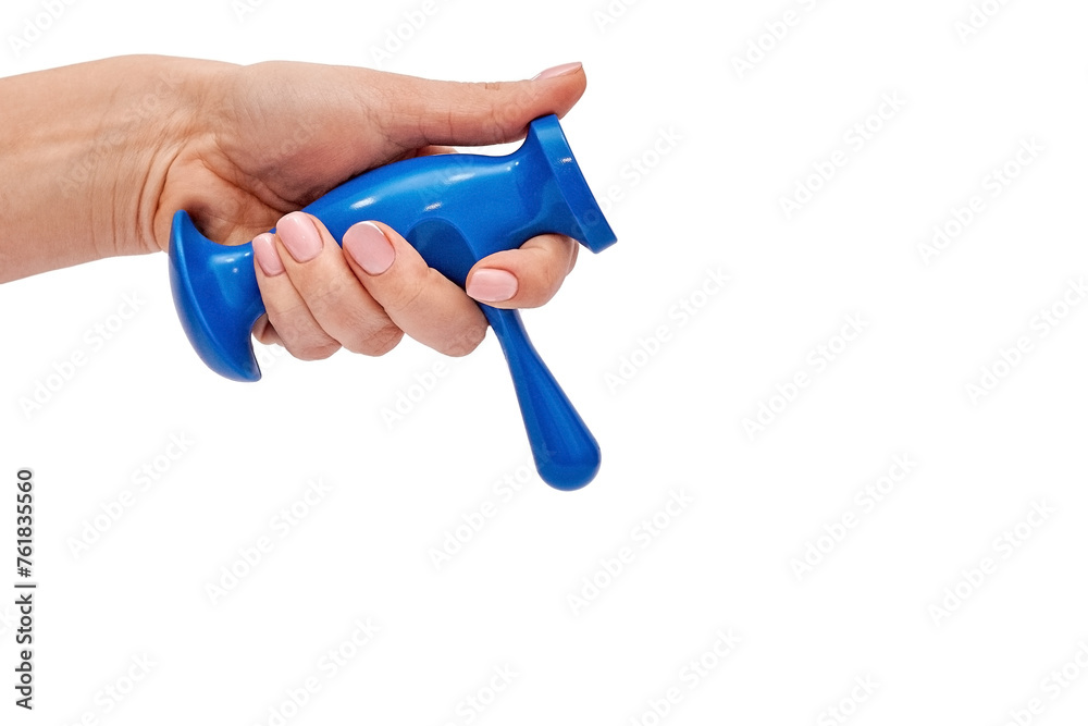 Trigger point massager in female hand on white background Trigger point massager in female hand on white background