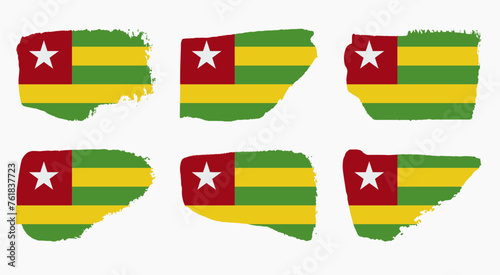 Togo flag set with palette knife paint brush strokes grunge texture design. Grunge brush stroke effect