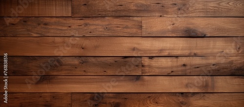 A closeup of a brown hardwood plank wall, showcasing the rich wood stain and intricate pattern of the building material. Lumber flooring in a rectangle shape