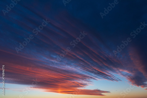 Obraz na płótnie Stunningly beautiful multi-colored violet-pink-lilac evening sky, multi-colored clouds fan out from the lower horizon w salonie