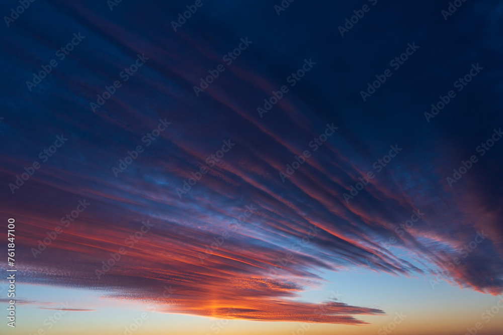 Stunningly beautiful multi-colored violet-pink-lilac evening sky, multi-colored clouds fan out from the lower horizon