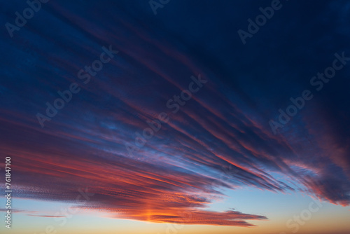 Obraz na płótnie Stunningly beautiful multi-colored violet-pink-lilac evening sky, multi-colored clouds fan out from the lower horizon w salonie