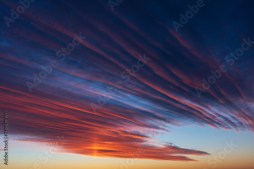 Obraz na płótnie Stunningly beautiful multi-colored violet-pink-lilac evening sky, multi-colored clouds fan out from the lower horizon w salonie