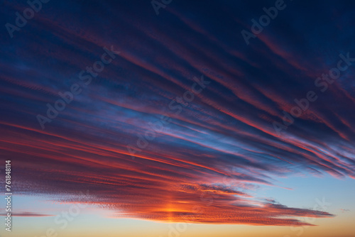 Stunningly beautiful multi-colored violet-pink-lilac evening sky, multi-colored clouds fan out from the lower horizon © Natalia