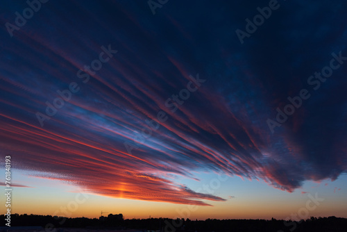 Obraz na płótnie Stunningly beautiful multi-colored violet-pink-lilac evening sky, multi-colored clouds fan out from the lower horizon w salonie